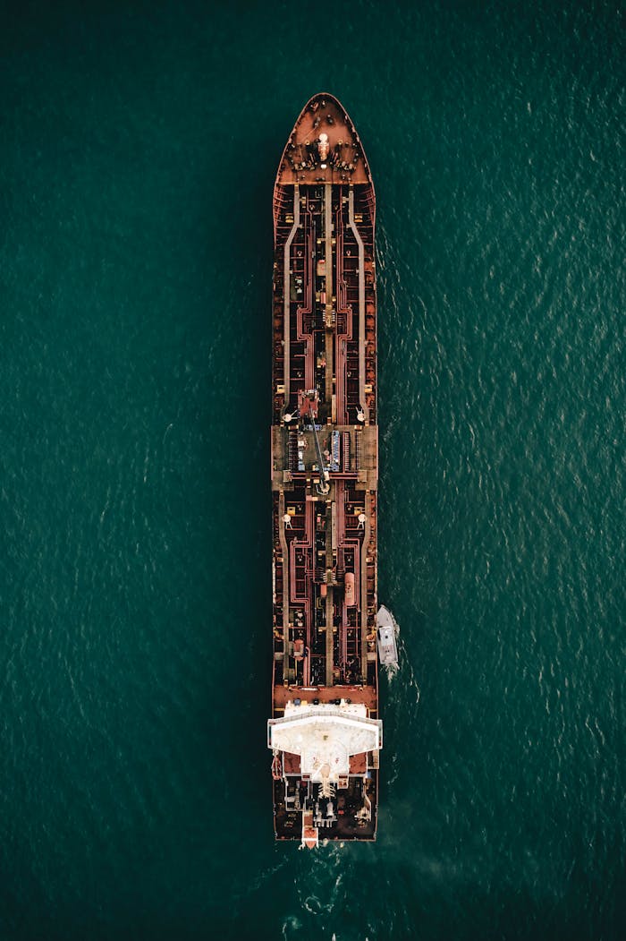 Stunning aerial view of a large cargo ship navigating through the Detroit waterways.